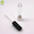 empty round clear lipstick container with black cap